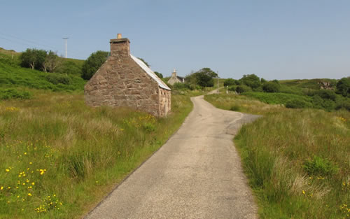 The road down to Cove Slipway is opposite the cottage